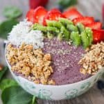 Blueberry Banana Smoothie Bowl with strawberries, kiwi, coconut, granola, and hemp seeds