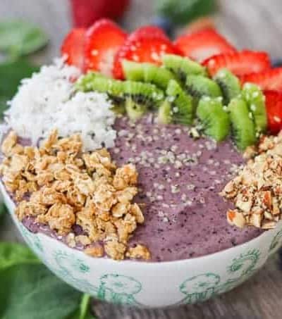 Blueberry Banana Smoothie Bowl with strawberries, kiwi, coconut, granola, and hemp seeds