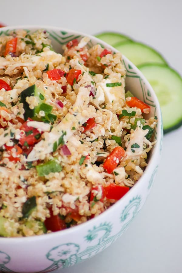 This Greek Quinoa Salad with quinoa, chicken, veggies and feta cheese tossed with a lemon vinaigrette. It's a great recipe for the heat of summer!