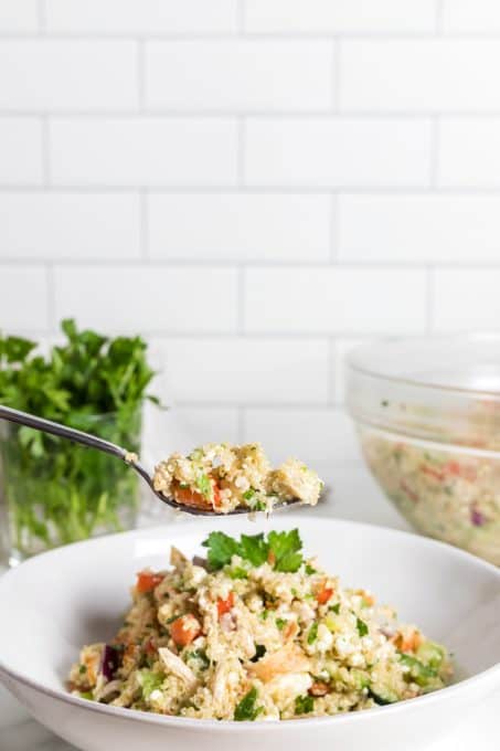 A chicken salad with quinoa and a Greek dressing.
