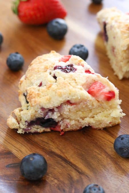 Mixed Berry Scones on wooden tray.