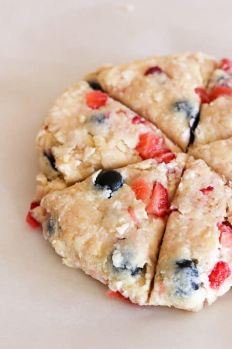 Mixed Berry Scones before baking on a parchment lined baking sheet.