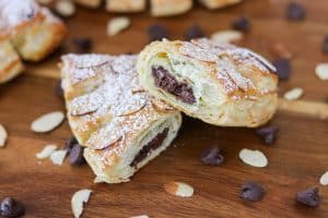 Look at all the delicious chocolate inside these Chocolate Bear Claws! They're made with puff pastry, chocolate chips, almonds and sprinkled with powdered sugar.