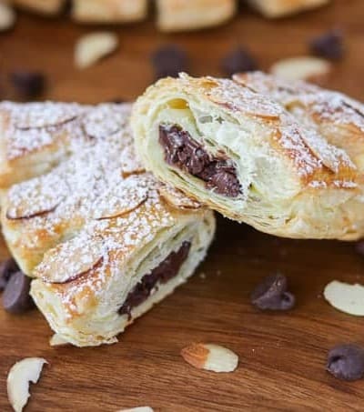Look at all the delicious chocolate inside these Chocolate Bear Claws! They're made with puff pastry, chocolate chips, almonds and sprinkled with powdered sugar.