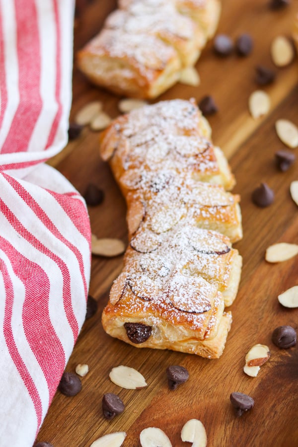 Top these Chocolate Bear Claws made of puff pastry and chocolate chips with sliced almonds and powdered sugar. Everyone will love them.