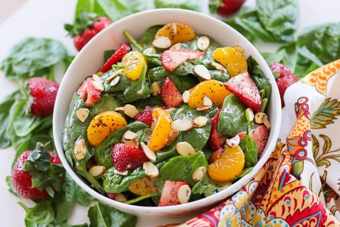 Spinach, strawberries, mandarin oranges, and almonds make up this delicious Strawberry Spinach Salad with a poppy seed dressing.
