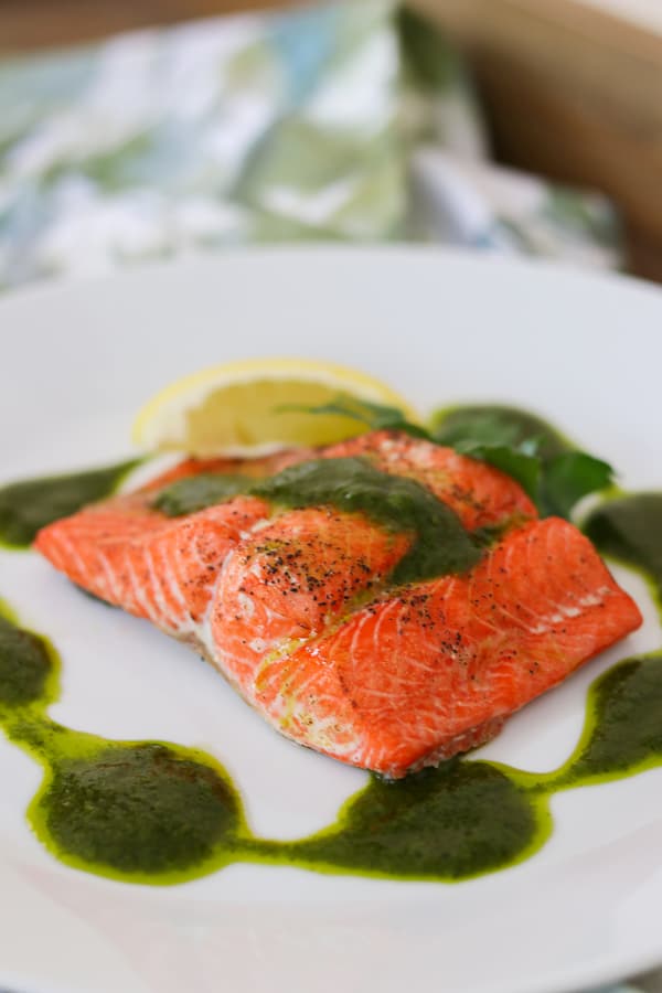 Roast salmon seasoned with olive oil, salt and pepper and topped with a delicious Chimichurri sauce.