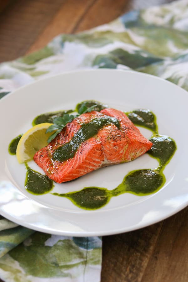 Increase the flavor, by adding a chimichurri sauce made of parsley, cilantro, olive oil and cumin to your roast salmon!