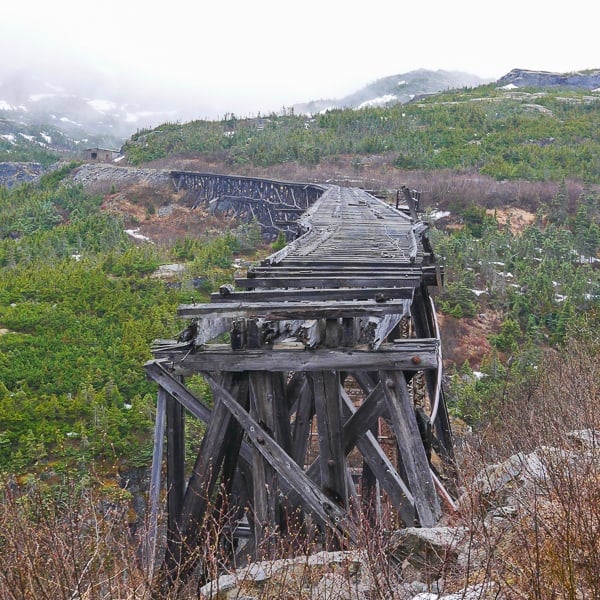 Old wooden bridge from the 1898 Gold Rush on our White Pass Scenic Railway. Just one of our Alaska Cruise Excursions.