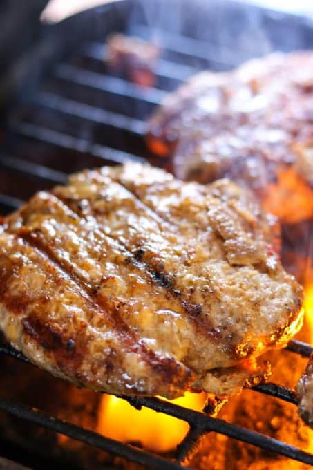 Grilling those delicious Cheesy Spiced Pork Burgers!