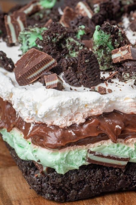 Layers of cookies, mint cheesecake , pudding and Cool Whip for an easy no bake dessert.