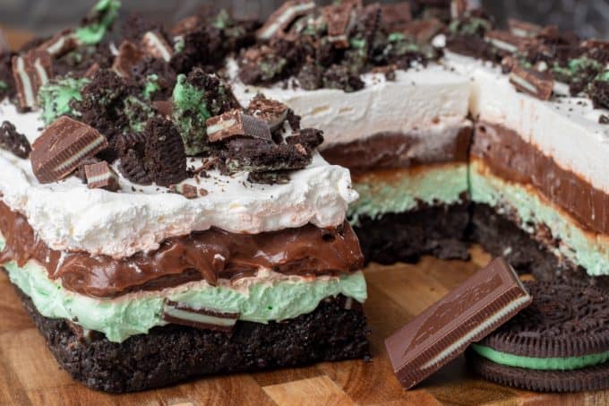 Cookie Crust, peppermint cheesecake, chocolate pudding, whipped topping and mint candies make this easy dessert.