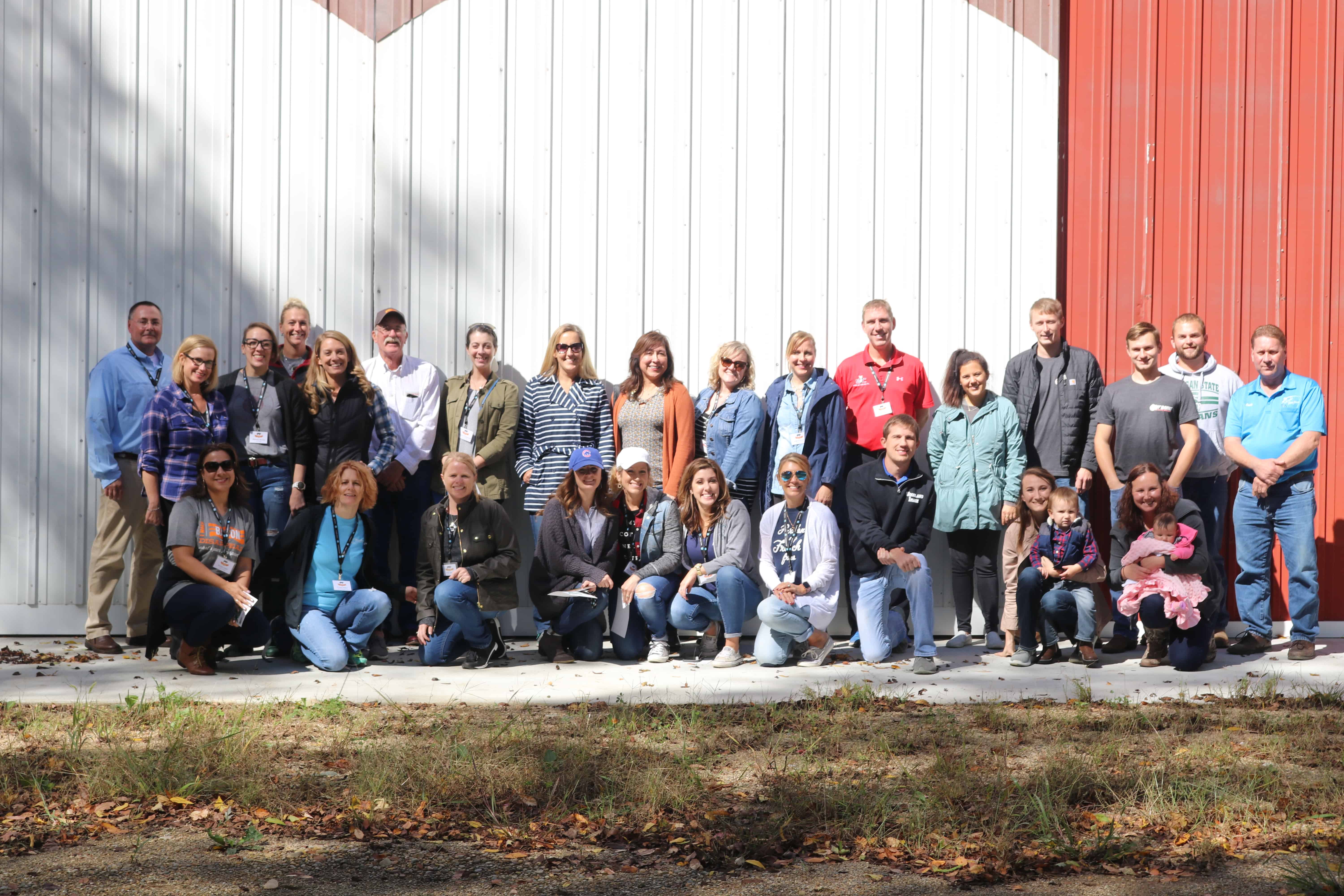 Food Bloggers and farmers touring pig farms in MI.