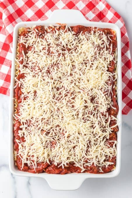 A pan of lasagna ready for the oven.