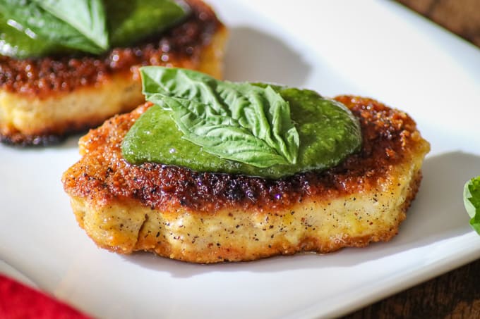 Parmesan Pork Chops with Pesto on plate.