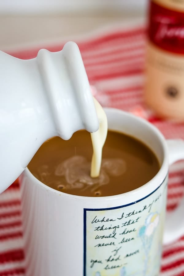 A cup of coffee with Peppermint White Chocolate Coffee Creamer.