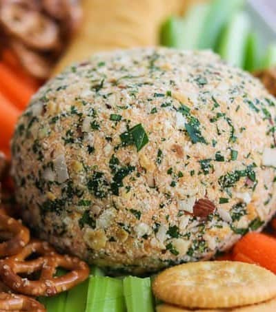 Buffalo Chicken Cheese Ball with carrots, celery, crackers and pretzels.