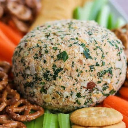 Buffalo Chicken Cheese Ball with carrots, celery, crackers and pretzels.