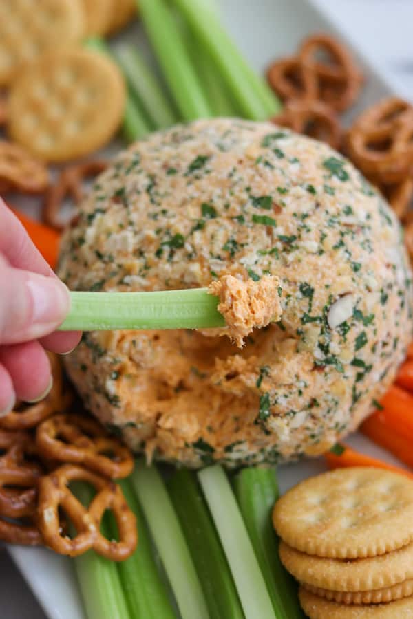 Buffalo Chicken Cheese Ball on a celery stick.