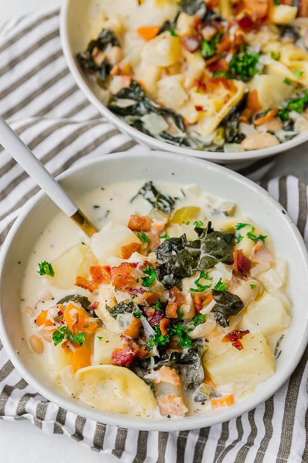 Close up of a bowl of One Pot Bacon and Tortellini Zuppa Toscana.