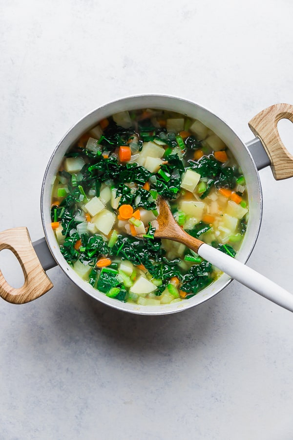 Vegetables and broth for One Pot Bacon and Tortellini Zuppa Toscana.