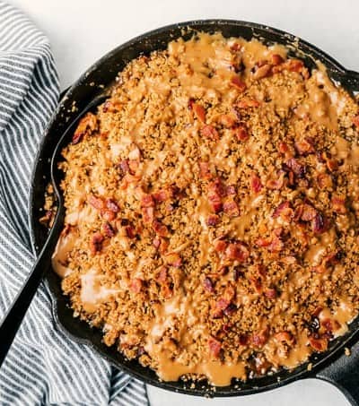 Bacon Caramel Apple Crisp with Pure Farmland Bacon in a cast iron skillet.