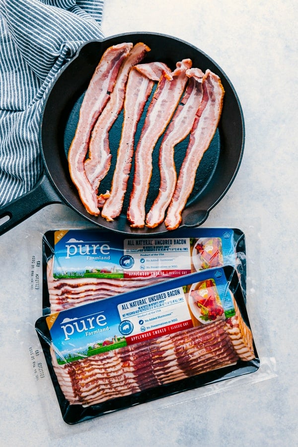 Pure Farmland Bacon cooking in a skillet for Bacon Caramel Apple Crisp.