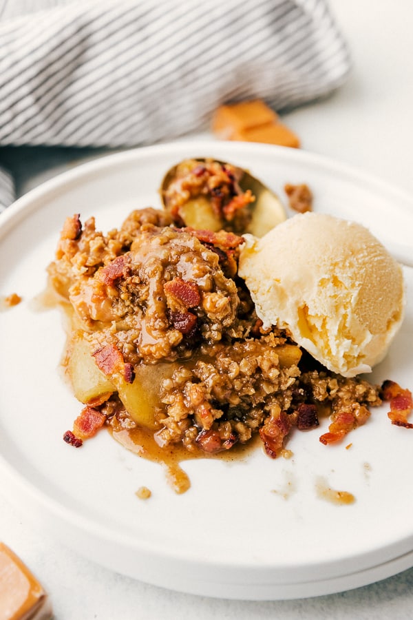 A plate of Bacon Caramel Apple Crisp Streusel with Pure Farmland Bacon.