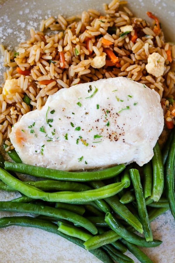 A balanced meal with Schwan's Vegetable Fried Rice, Chicken Breast Fillet and MicroSteam Whole Green Beans.