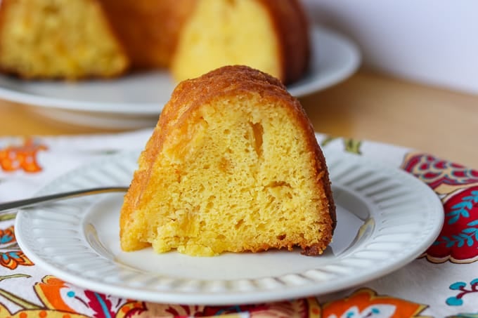 Side shot of Pineapple Rum Cake on a plate.