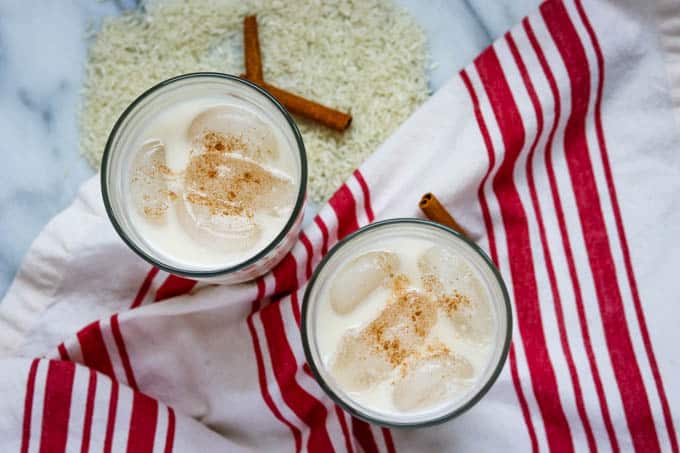 Overhead shot of two glasses of Horchata, a Mexican rice drink recipe.