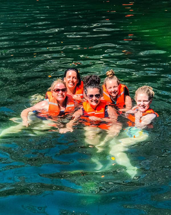 Swimming in a cenote in Tulum, Mexico.