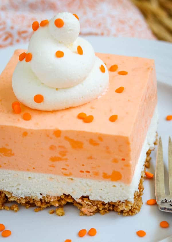 A slice of Orange Creamsicle Dream Bars on a plate.