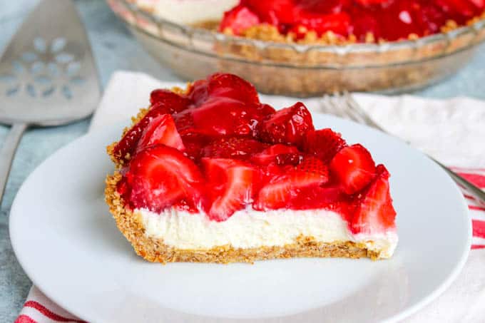 A slice of Strawberry Pretzel Pie on a plate.