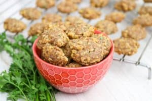 A bowl and rack of DIY Chicken and Cheese Dog Treats.