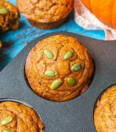 A Dairy-Free Pumpkin Muffin in a baking tin.