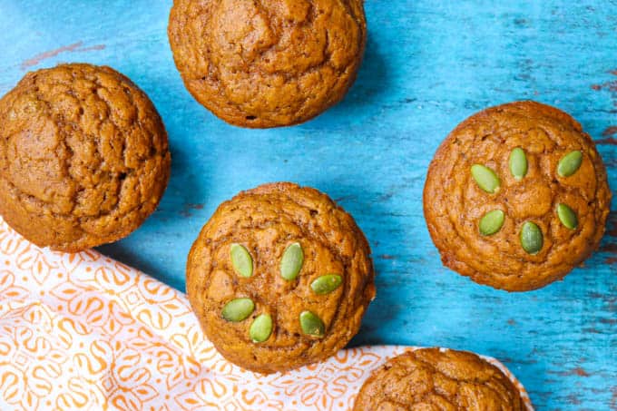 Dairy-Free Pumpkin Muffins next to an orange napkin.