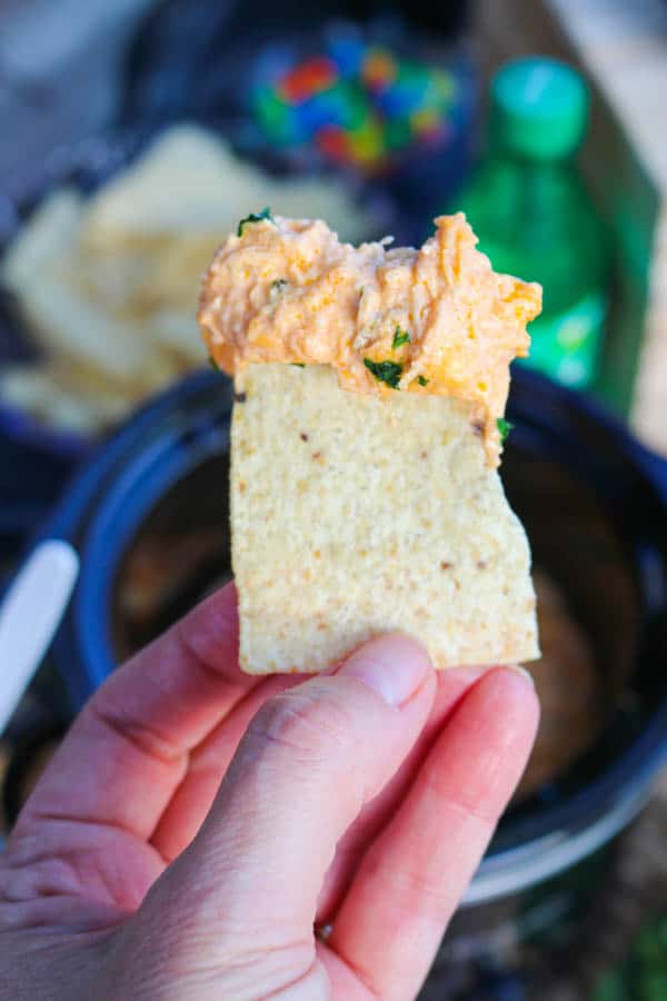 Slow Cooker Buffalo Chicken Dip on a tortilla chip.