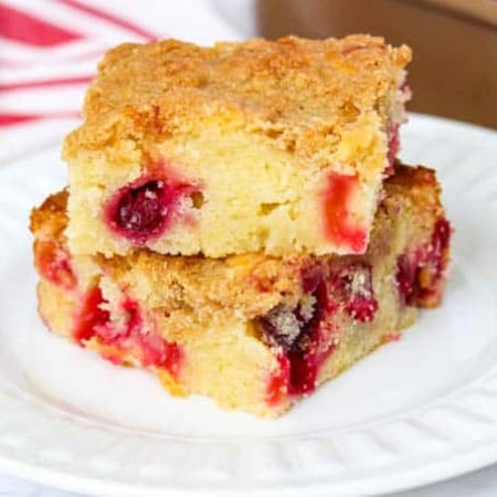 Two slices of Cranberry Coffee Cake on a plate.