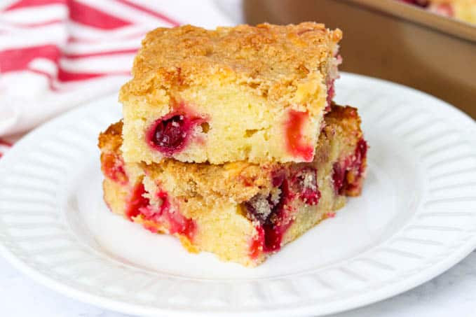 Two slices of Cranberry Coffee Cake on a plate.
