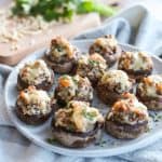 Cheesy Sausage Stuffed Mushrooms on a plate.