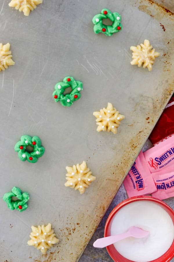 Spritz cookie dough on a baking sheet and ready to be baked. Spritz Cookies ready for the oven.