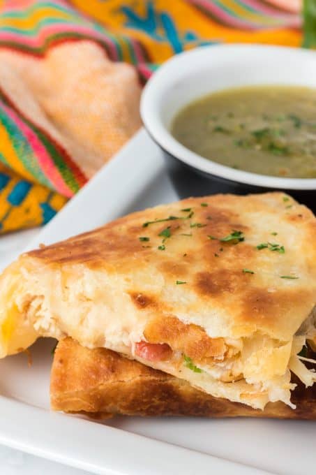 A cheesy quesadilla with chicken.