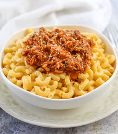 A bowl of BBQ Pork Mac & Cheese on a plate.