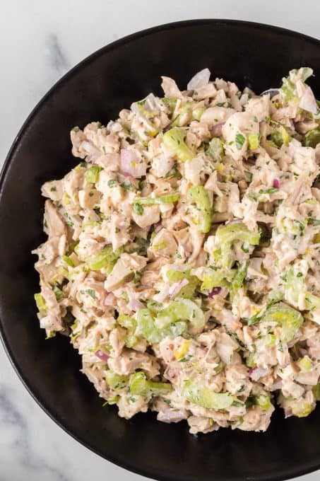 A bowl of chicken salad made without mayonnaise.