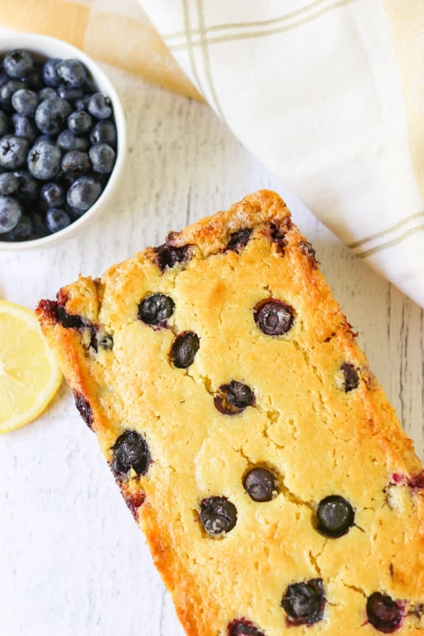 A loaf of Lemon Blueberry Bread. Easy to make, but even easier to eat, this Lemon Blueberry quick bread will put a smile on your face.