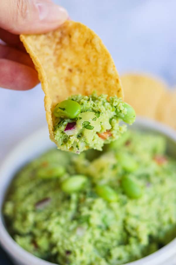 Some guacamole with soybeans on a chip.