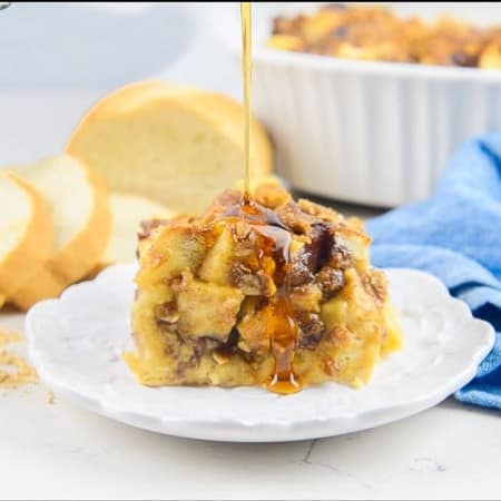 Syrup drizzled on Peanut Butter and Jelly French Toast Casserole.