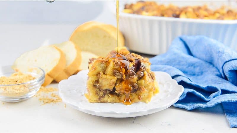 Syrup drizzled on Peanut Butter and Jelly French Toast Casserole.