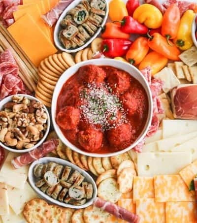 An assortment of meats, cheeses, crackers, nuts, veggies, meatballs and more perfect for snacking, entertaining and dinner!